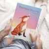 Lecture de l'album jeunesse Premiers flocons par un enfant et son papa